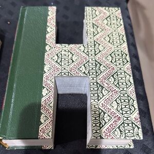 Green and Cream Decorative Book Shaped Letter 'H'